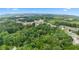 Scenic aerial view of the property surrounded by lush greenery, highlighting its desirable location and natural beauty at 12728 Bells Ferry Rd, Canton, GA 30114