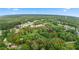 Aerial view of a large, private parcel outlined in red, surrounded by lush greenery and mature trees at 12728 Bells Ferry Rd, Canton, GA 30114