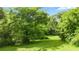 Expansive backyard featuring a well-maintained lawn, mature trees, and ample space for outdoor activities at 12728 Bells Ferry Rd, Canton, GA 30114