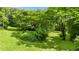 Expansive backyard featuring a well-maintained lawn, mature trees, and ample space for outdoor activities at 12728 Bells Ferry Rd, Canton, GA 30114