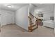 Finished basement with carpeted floor and stairs leading to living area at 220 Broadmoor Dr, Fayetteville, GA 30215