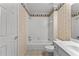 Bathroom with white fixtures and a tiled shower/tub combination at 220 Broadmoor Dr, Fayetteville, GA 30215