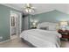 Stylish bedroom with a ceiling fan, en-suite bathroom, and calming colors; perfect for relaxation at 220 Broadmoor Dr, Fayetteville, GA 30215