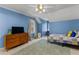 Inviting bedroom with a cozy rug, dresser, and lots of natural light from the window at 220 Broadmoor Dr, Fayetteville, GA 30215