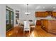Bright dining area with hardwood floors and a view of the outdoor space at 220 Broadmoor Dr, Fayetteville, GA 30215