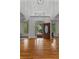 Stunning foyer with high ceilings, hardwood floors, and an open doorway leading to a brick walkway at 220 Broadmoor Dr, Fayetteville, GA 30215