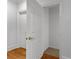 A bright hallway with white trim showcasing an open closet space at 220 Broadmoor Dr, Fayetteville, GA 30215