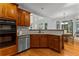 Modern kitchen with granite countertops, stainless steel appliances and a view to the dining area at 220 Broadmoor Dr, Fayetteville, GA 30215