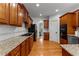Well-equipped kitchen featuring granite countertops, hardwood floors, and modern appliances at 220 Broadmoor Dr, Fayetteville, GA 30215