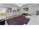 Bright basement living area with built-ins, large rug and white sectional at 220 Broadmoor Dr, Fayetteville, GA 30215