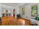 Charming living room with an archway leading to the dining room, hardwood floors, and natural light at 220 Broadmoor Dr, Fayetteville, GA 30215