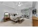 Spacious main bedroom with a tray ceiling, sitting area, and large windows with plantation shutters at 220 Broadmoor Dr, Fayetteville, GA 30215
