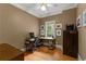 Office with hardwood flooring, a large window, and traditional-style furnishings at 220 Broadmoor Dr, Fayetteville, GA 30215