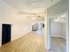 Large bonus room with new flooring, fans, and plenty of space for activities at 345 Etheridge Rd, Auburn, GA 30011