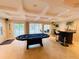 Entertaining game room with poker table, bar, and access to the outdoor pool at 345 Etheridge Rd, Auburn, GA 30011