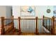 Elegant staircase with wooden railings and wrought iron spindles at 345 Etheridge Rd, Auburn, GA 30011