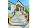 A stairway with wooden posts and metal cable railings, leading to the house at 345 Etheridge Rd, Auburn, GA 30011