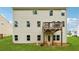 The backyard has a deck and mature green grass at 520 Edgemore Rd, Canton, GA 30114