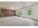Spacious unfinished basement with concrete floor, plywood ceiling, and exterior access at 520 Edgemore Rd, Canton, GA 30114