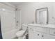 Well-lit bathroom with tub/shower combo, modern vanity, and neutral color palette at 520 Edgemore Rd, Canton, GA 30114