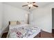 Bedroom featuring hardwood floors, a ceiling fan, and ample closet space at 520 Edgemore Rd, Canton, GA 30114