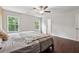 Bedroom featuring hardwood floors, a ceiling fan, and lots of natural light at 520 Edgemore Rd, Canton, GA 30114