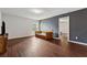 Bonus room area with an interesting headboard, hardwood floors, and a calming paint color at 520 Edgemore Rd, Canton, GA 30114