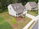 Charming two-story home with a well-manicured front yard and covered porch at 520 Edgemore Rd, Canton, GA 30114