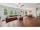 Bright living room with hardwood floors, a sectional couch, and lots of natural light at 520 Edgemore Rd, Canton, GA 30114