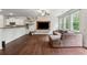 Open living space with a sectional sofa, a built-in media center, and views to outside at 520 Edgemore Rd, Canton, GA 30114