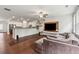 Bright and open living space with hardwood floors, a comfortable sofa, and seamless access to the kitchen at 520 Edgemore Rd, Canton, GA 30114