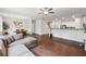 Open living space connects to dining and kitchen areas, featuring hardwood floors and ample seating at 520 Edgemore Rd, Canton, GA 30114