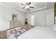 Bright main bedroom features a ceiling fan, tray ceiling, and a dresser with mirror at 520 Edgemore Rd, Canton, GA 30114