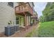 View of a backyard with a patio and a row of air conditioning units at 6895 Slate Stone Se Way # 3, Mableton, GA 30126