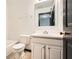 Cozy bathroom featuring a single sink vanity, mirror and a toilet next to the shower at 6895 Slate Stone Se Way # 3, Mableton, GA 30126