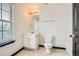 Cozy bathroom featuring a single sink vanity, mirror and a toilet next to the shower at 6895 Slate Stone Se Way # 3, Mableton, GA 30126