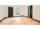 Large bedroom featuring light wood floors, white walls, and a window letting in natural light at 6895 Slate Stone Se Way # 3, Mableton, GA 30126