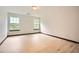Bright bedroom with hardwood floors and two windows at 6895 Slate Stone Se Way # 3, Mableton, GA 30126