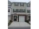 Two-story townhome with brick accents, a front-entry garage and black shutters for a clean, modern look at 6895 Slate Stone Se Way # 3, Mableton, GA 30126