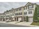 Row of townhomes with neutral siding, black shutters, manicured lawns, and attached garages in a well-maintained community at 6895 Slate Stone Se Way # 3, Mableton, GA 30126
