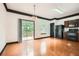 Open kitchen and dining area with hardwood floors and a sliding glass door to the deck at 6895 Slate Stone Se Way # 3, Mableton, GA 30126