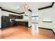 Spacious kitchen with stainless steel appliances, dark cabinets, and hardwood floors at 6895 Slate Stone Se Way # 3, Mableton, GA 30126