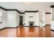 Inviting living room with hardwood floors, a cozy fireplace, and an open layout leading into the kitchen area at 6895 Slate Stone Se Way # 3, Mableton, GA 30126