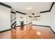Spacious living room with hardwood floors, a fireplace, and an open staircase leading to the upper level at 6895 Slate Stone Se Way # 3, Mableton, GA 30126