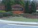 A community sign with landscaping, brick accents, and an elegant, arched design reading Brookview at 6895 Slate Stone Se Way # 3, Mableton, GA 30126