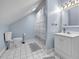 Bathroom featuring a toilet, sink, shower with curtain, and white tiled floor at 7212 Avalon Dr, Douglasville, GA 30135