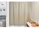 Bathroom with a gray shower curtain and stack of towels at 7212 Avalon Dr, Douglasville, GA 30135