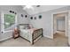 Cozy bedroom featuring a vaulted ceiling, natural light, and a charming wrought iron bed frame at 7212 Avalon Dr, Douglasville, GA 30135