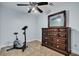 Bedroom with a dresser, exercise bike, and ceiling fan at 7212 Avalon Dr, Douglasville, GA 30135