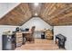 Bonus room with wood-paneled ceiling and floor and decorative barrels at 7212 Avalon Dr, Douglasville, GA 30135